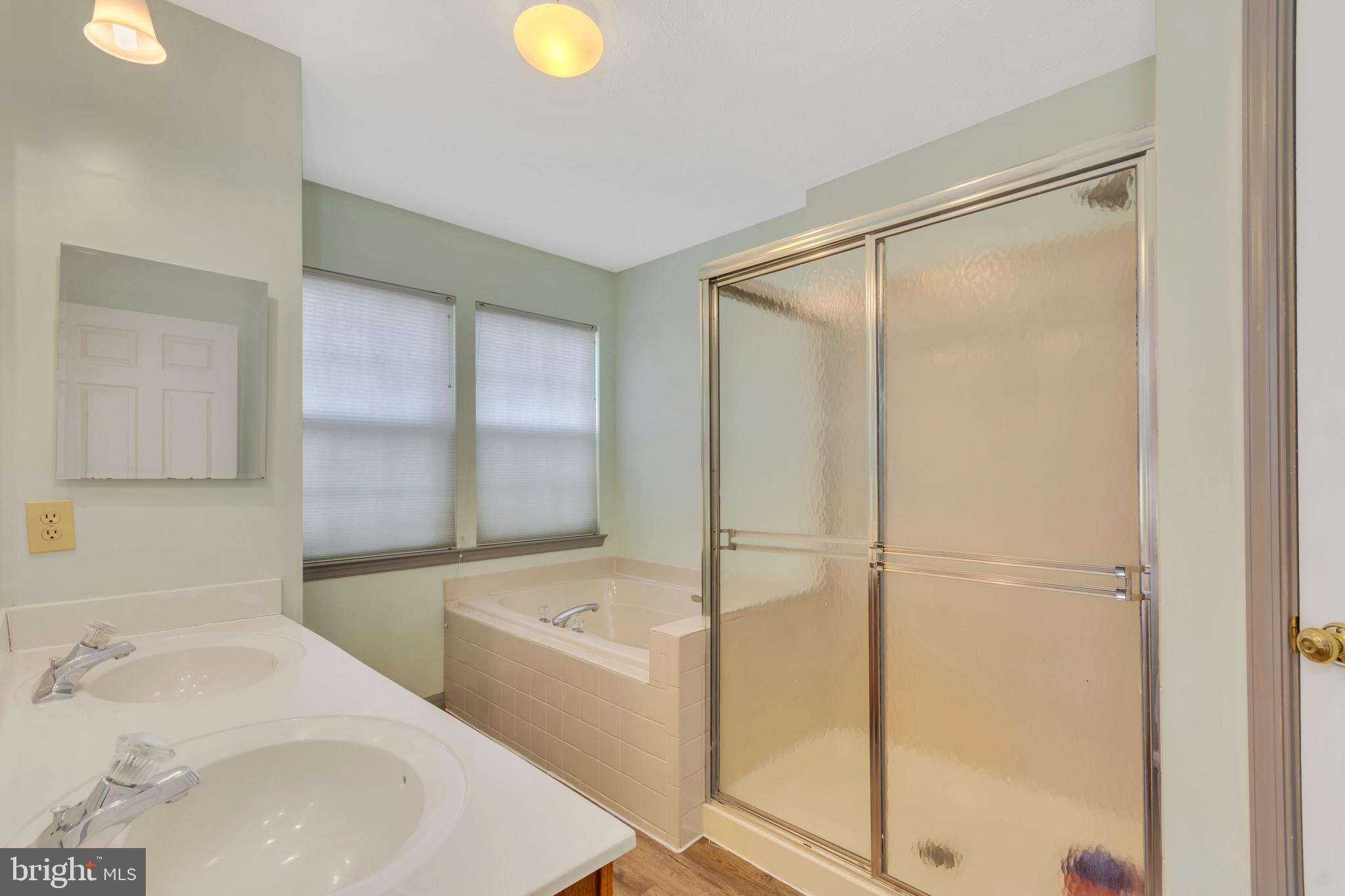 2908 Garwood Road Sicklerville, NJ 08081 - Photo 10 of 25 a bathroom with a sink and a bathtub