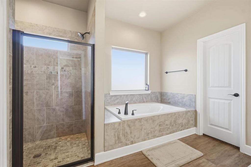 7414 Morning Glory Road Abilene, TX 79602 - Photo 24 of 34 a bathroom with a tub shower and sink