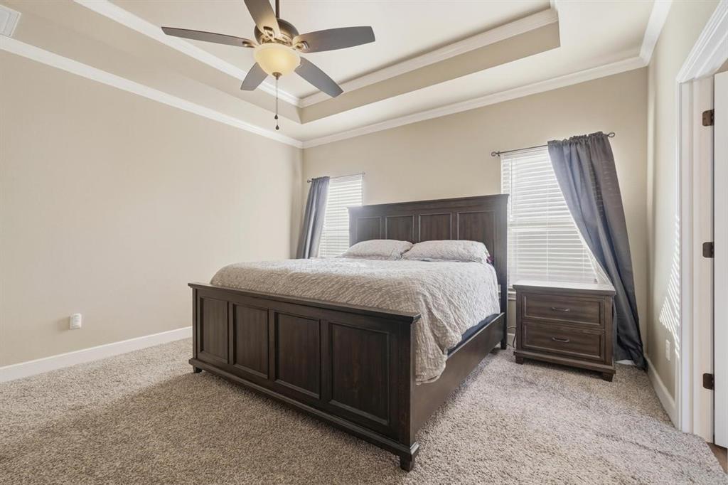 7414 Morning Glory Road Abilene, TX 79602 - Photo 26 of 34 a large bed sitting in a room next to a window