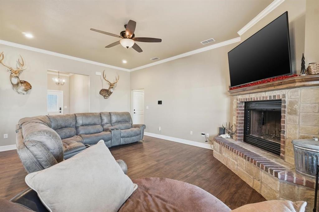 7414 Morning Glory Road Abilene, TX 79602 - Photo 30 of 34 a living room with furniture and a fireplace