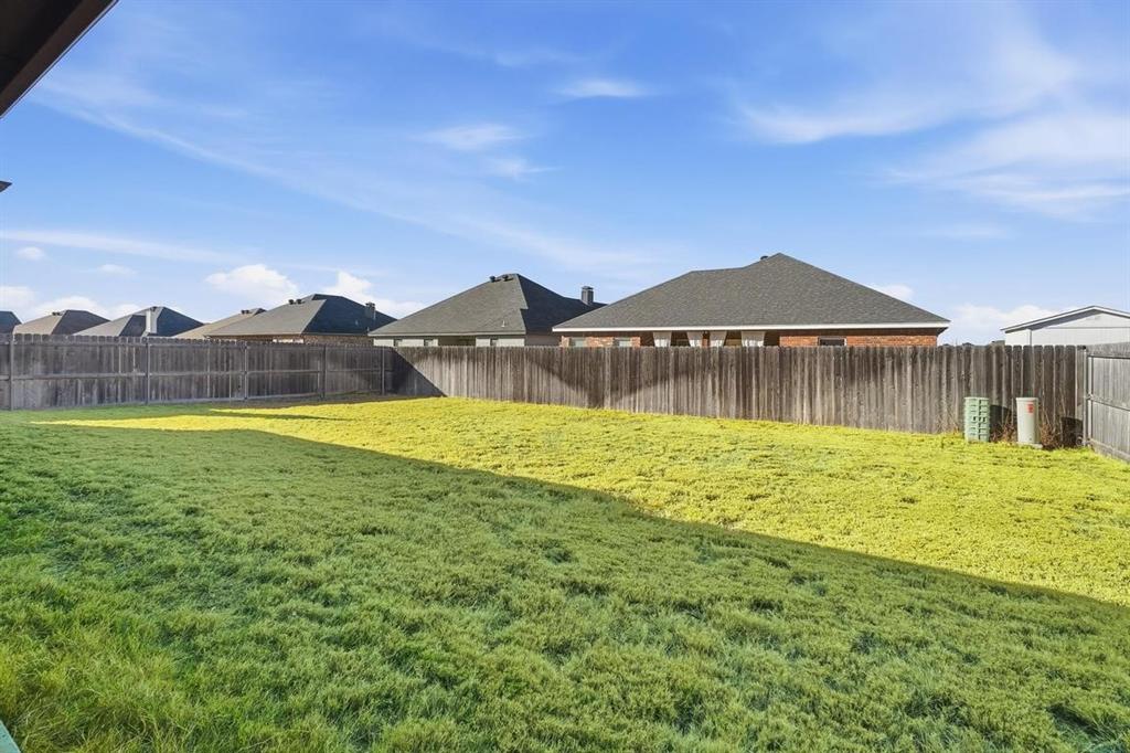 7414 Morning Glory Road Abilene, TX 79602 - Photo 3 of 34 a view of a house with a yard and a large tree