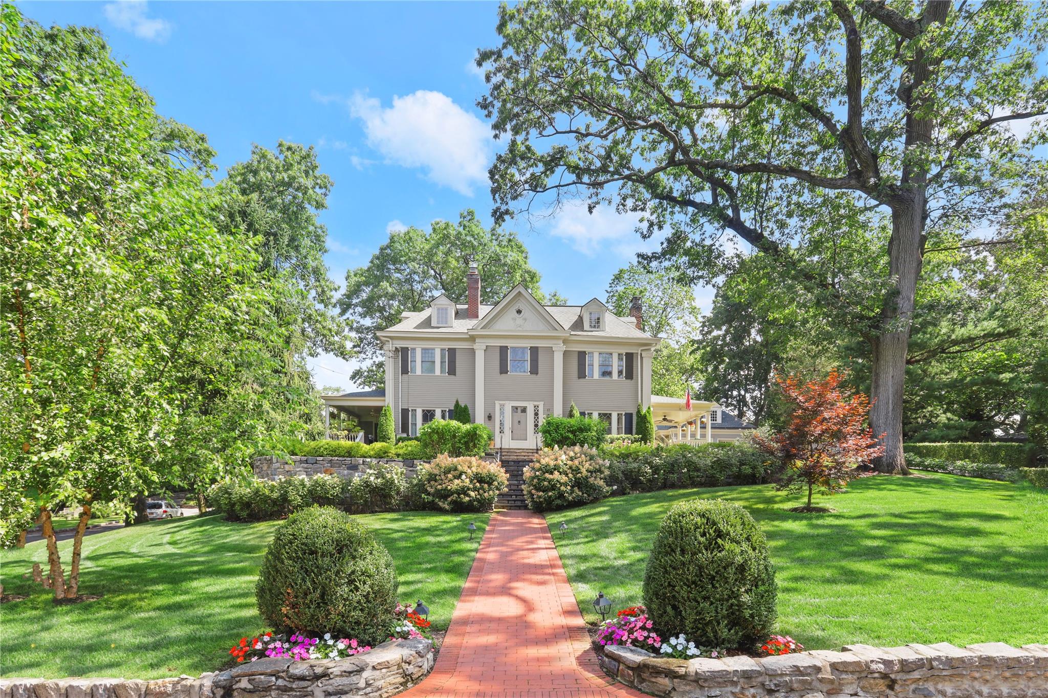 17 Gladwin Place Bronxville, NY 10708 - Photo 1 of 1 Colonial-style house with a front lawn