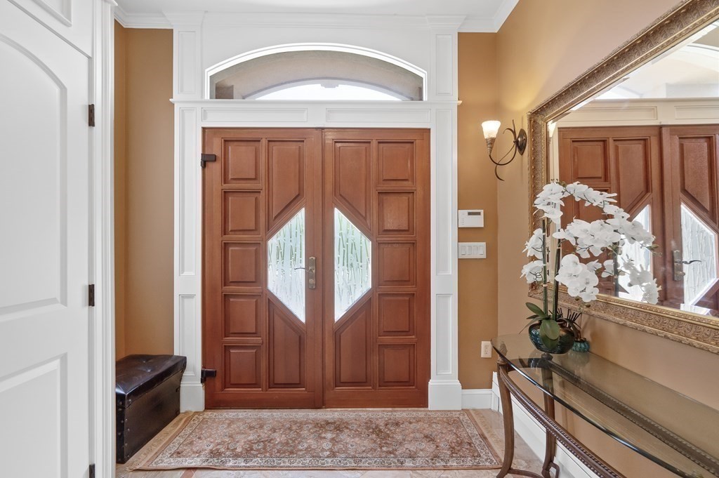 113 Deborah Road Newton, MA 02459 - Photo 6 of 34 a front view of a house with wooden floor and a wooden door