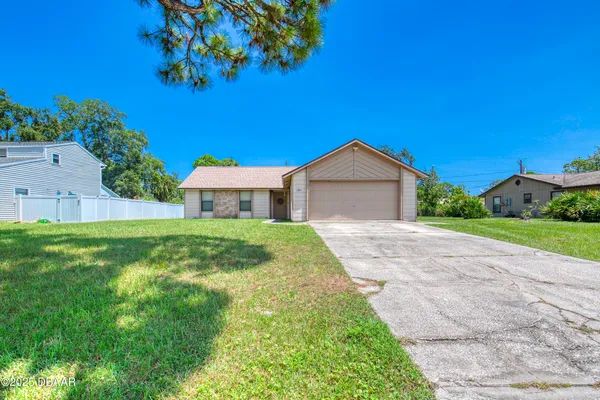 a house view with a garden space
