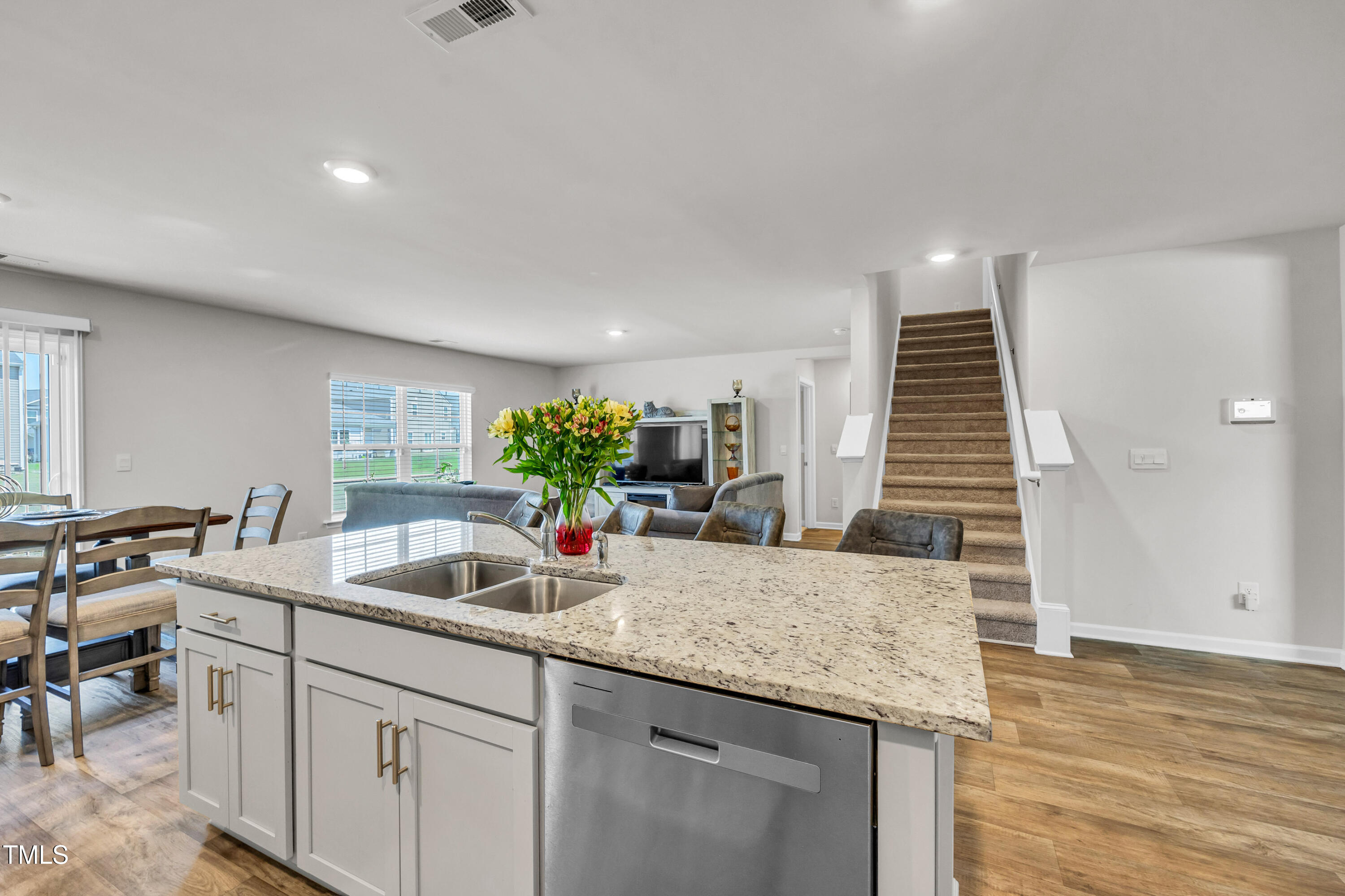 2923 Cullens Drive Graham, NC 27253 - Photo 11 of 48 a kitchen with granite countertop a sink and a white wooden cabinets