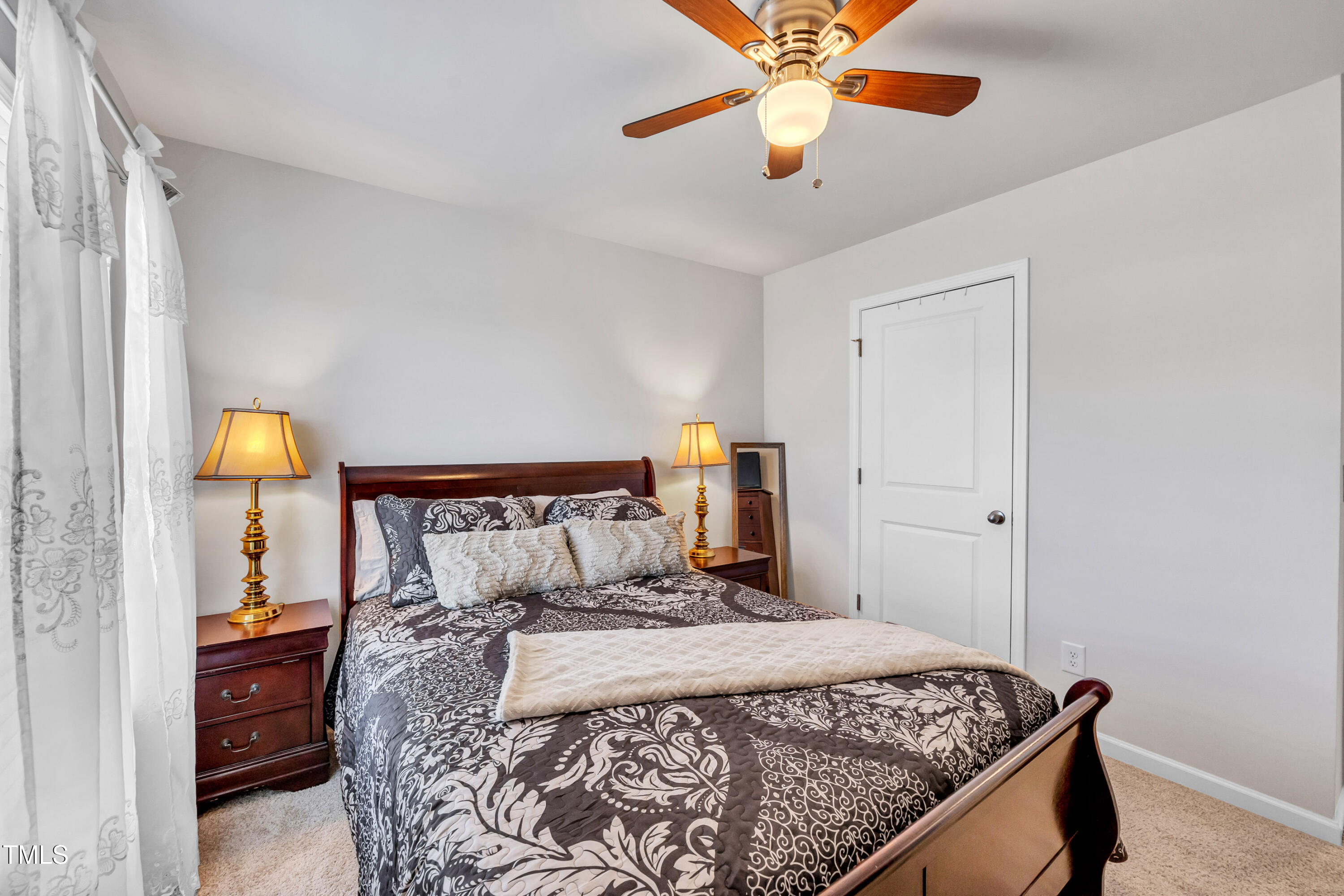 2923 Cullens Drive Graham, NC 27253 - Photo 14 of 48 a bedroom with a bed and a chandelier