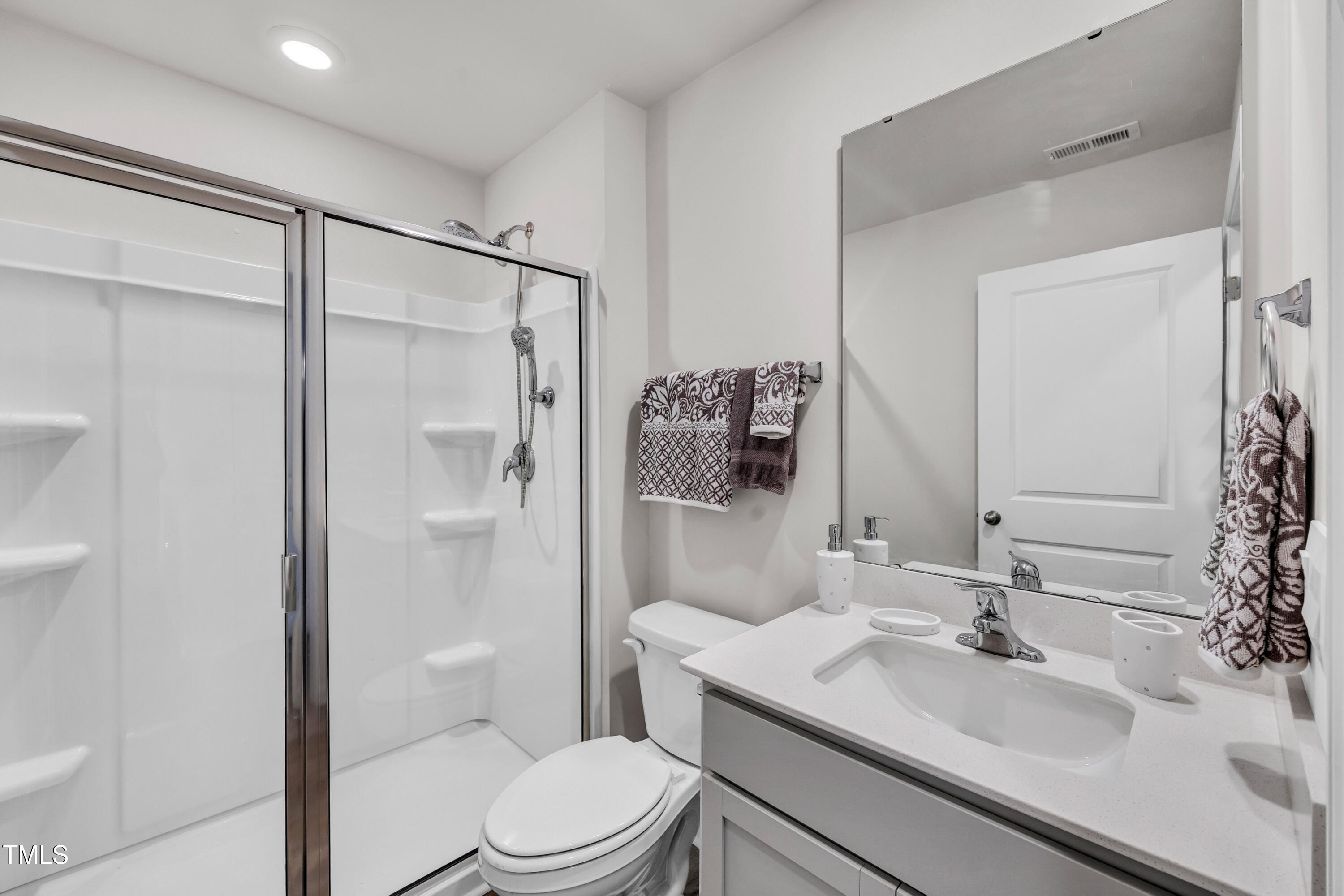 2923 Cullens Drive Graham, NC 27253 - Photo 15 of 48 a bathroom with a sink toilet and shower
