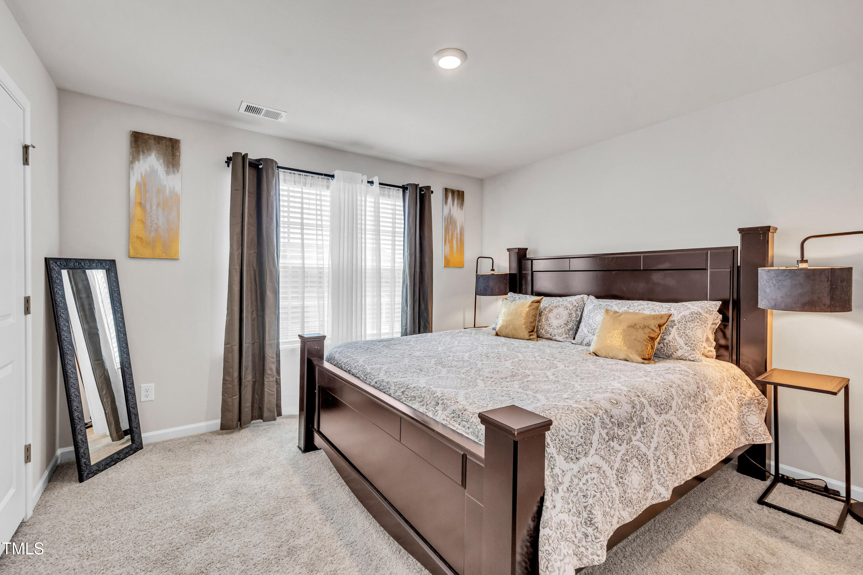 2923 Cullens Drive Graham, NC 27253 - Photo 16 of 48 a bedroom with a bed and a window