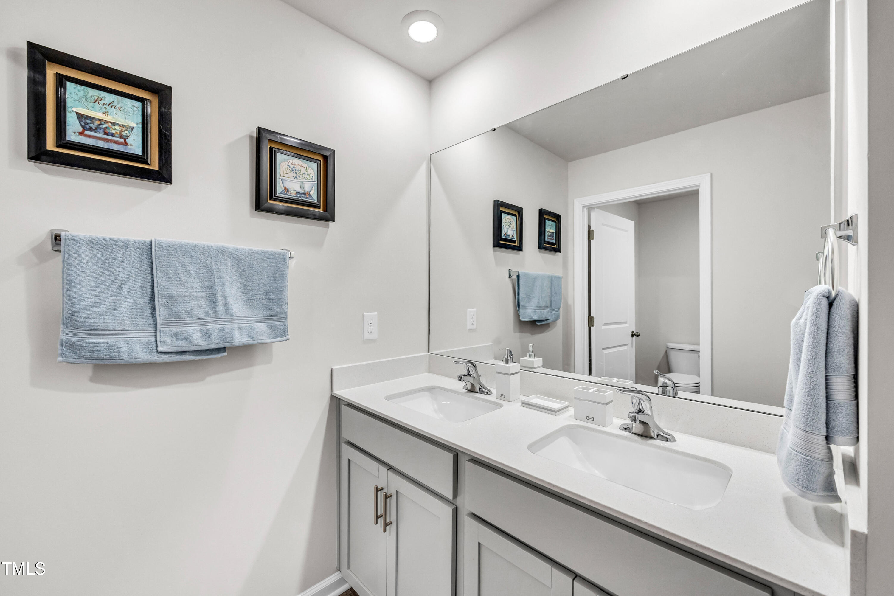 2923 Cullens Drive Graham, NC 27253 - Photo 18 of 48 a bathroom with a double vanity sink mirror and