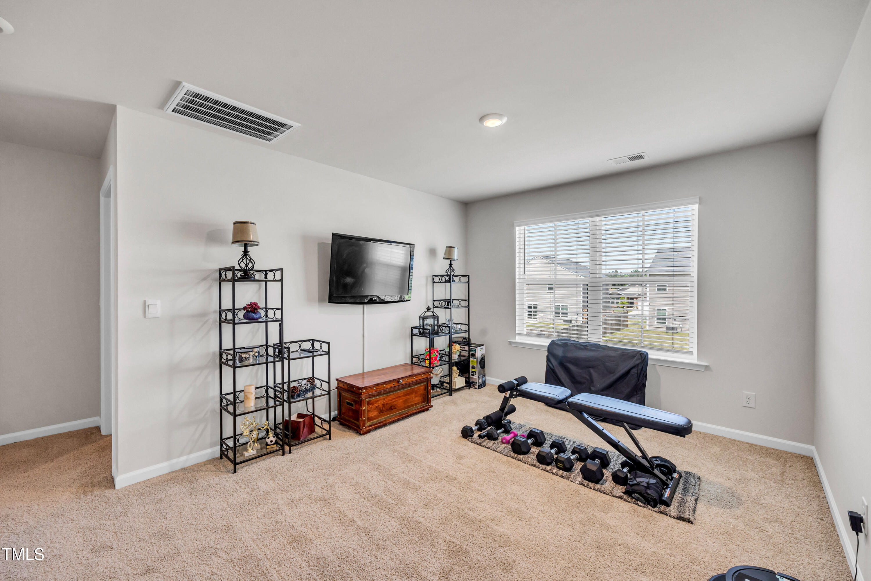 2923 Cullens Drive Graham, NC 27253 - Photo 22 of 48 a living room with furniture and a flat screen tv