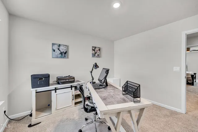 a view of a workspace with furniture