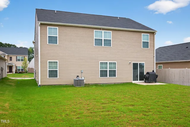 a house that has a big yard in front of it