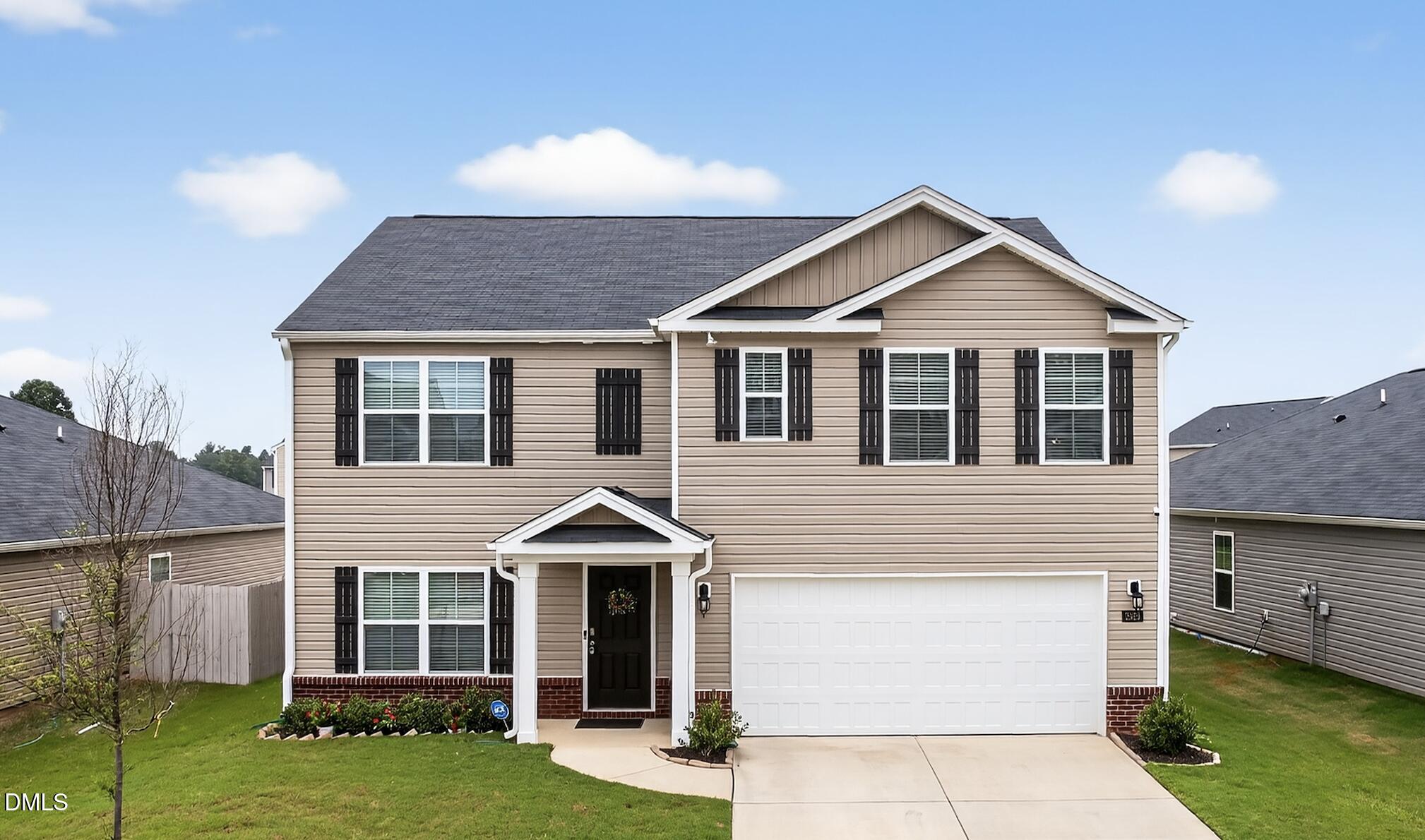 2923 Cullens Drive Graham, NC 27253 - Photo 39 of 48 a front view of a house with garden