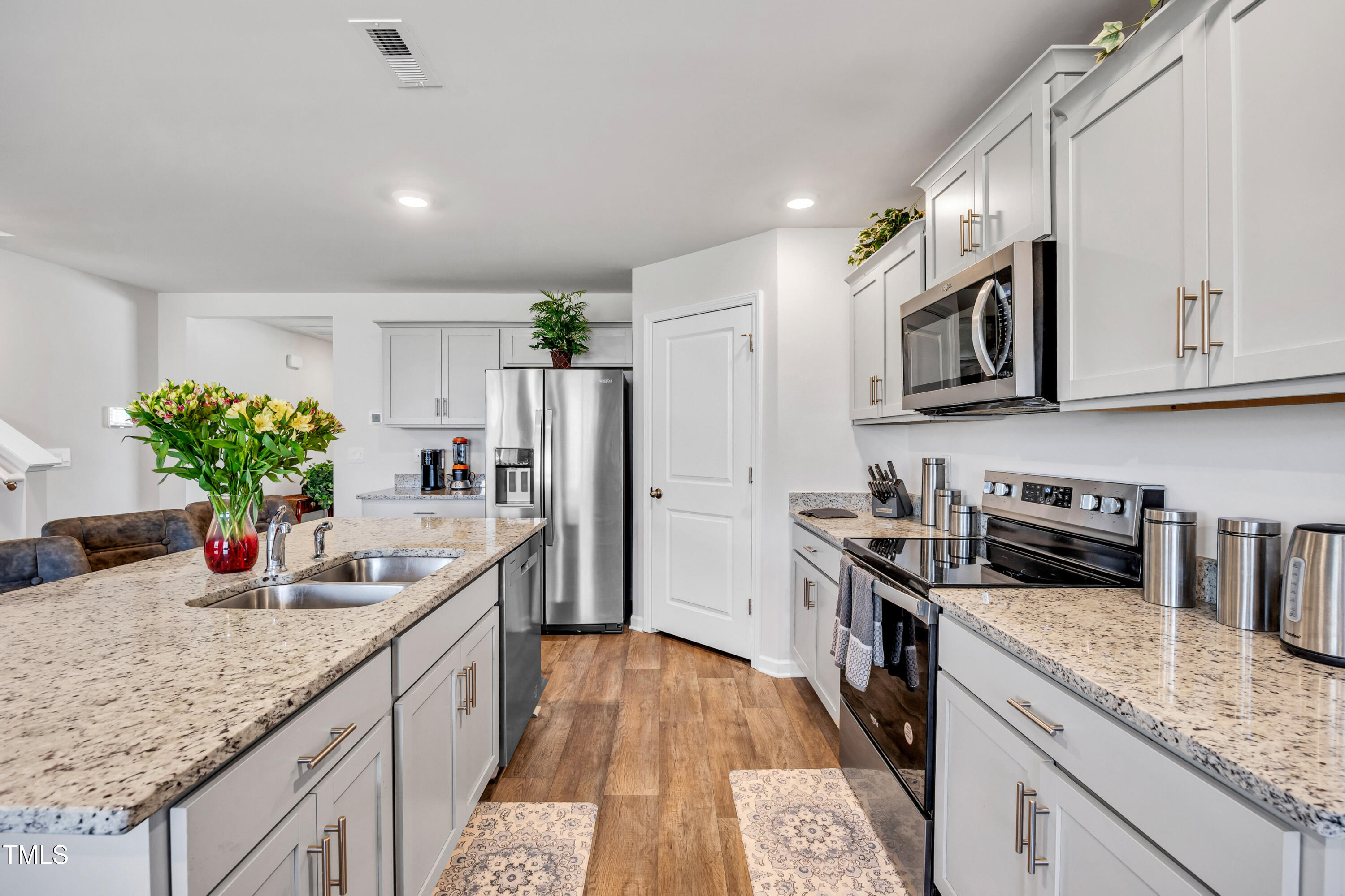 2923 Cullens Drive Graham, NC 27253 - Photo 6 of 48 a kitchen with stainless steel appliances granite countertop a sink stove and refrigerator