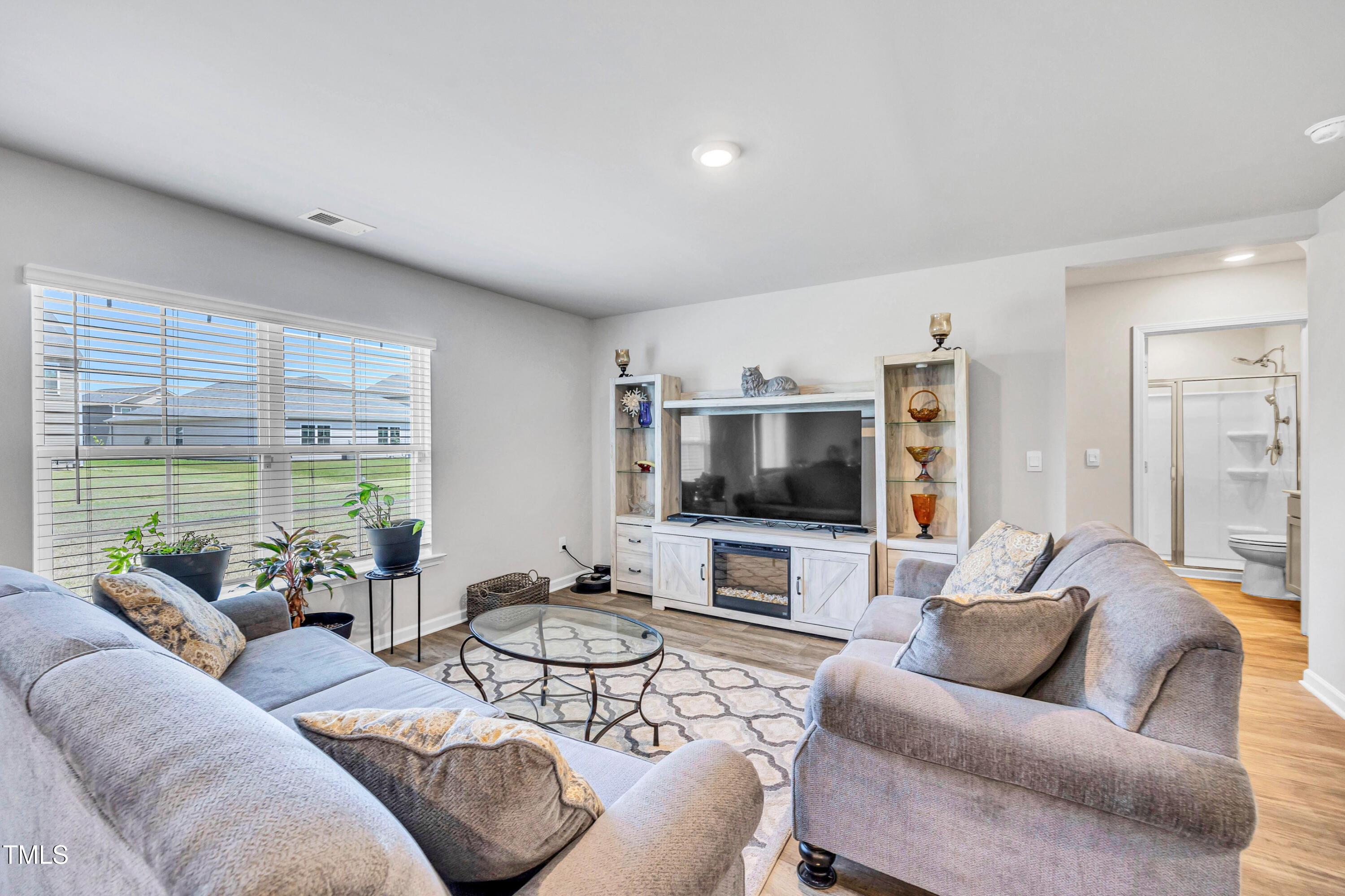 2923 Cullens Drive Graham, NC 27253 - Photo 7 of 48 a living room with furniture and a flat screen tv