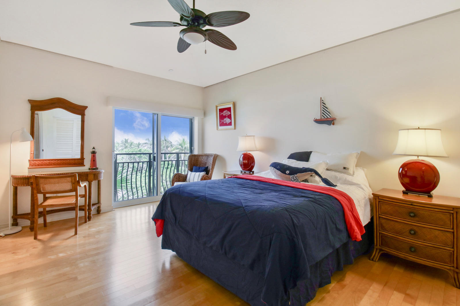 314 Inlet Way, Unit 303 Palm Beach Shores, FL 33404 - Photo 21 of 33 a bedroom with a bed and a chandelier