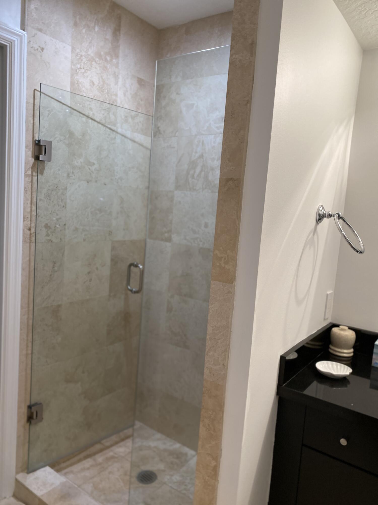 314 Inlet Way, Unit 303 Palm Beach Shores, FL 33404 - Photo 25 of 33 a bathroom with a shower and a sink