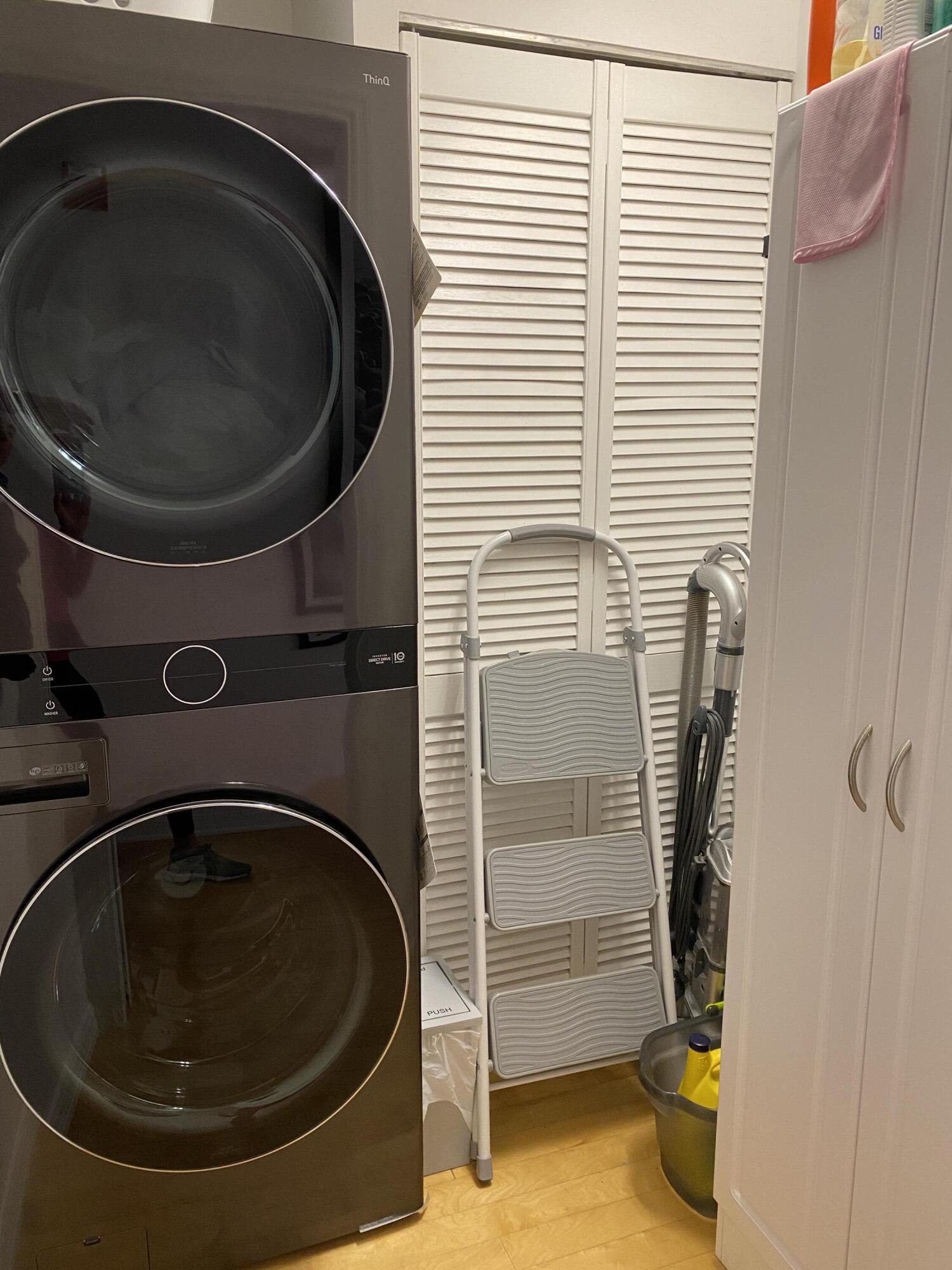 314 Inlet Way, Unit 303 Palm Beach Shores, FL 33404 - Photo 27 of 33 a utility room with sink dryer and washer