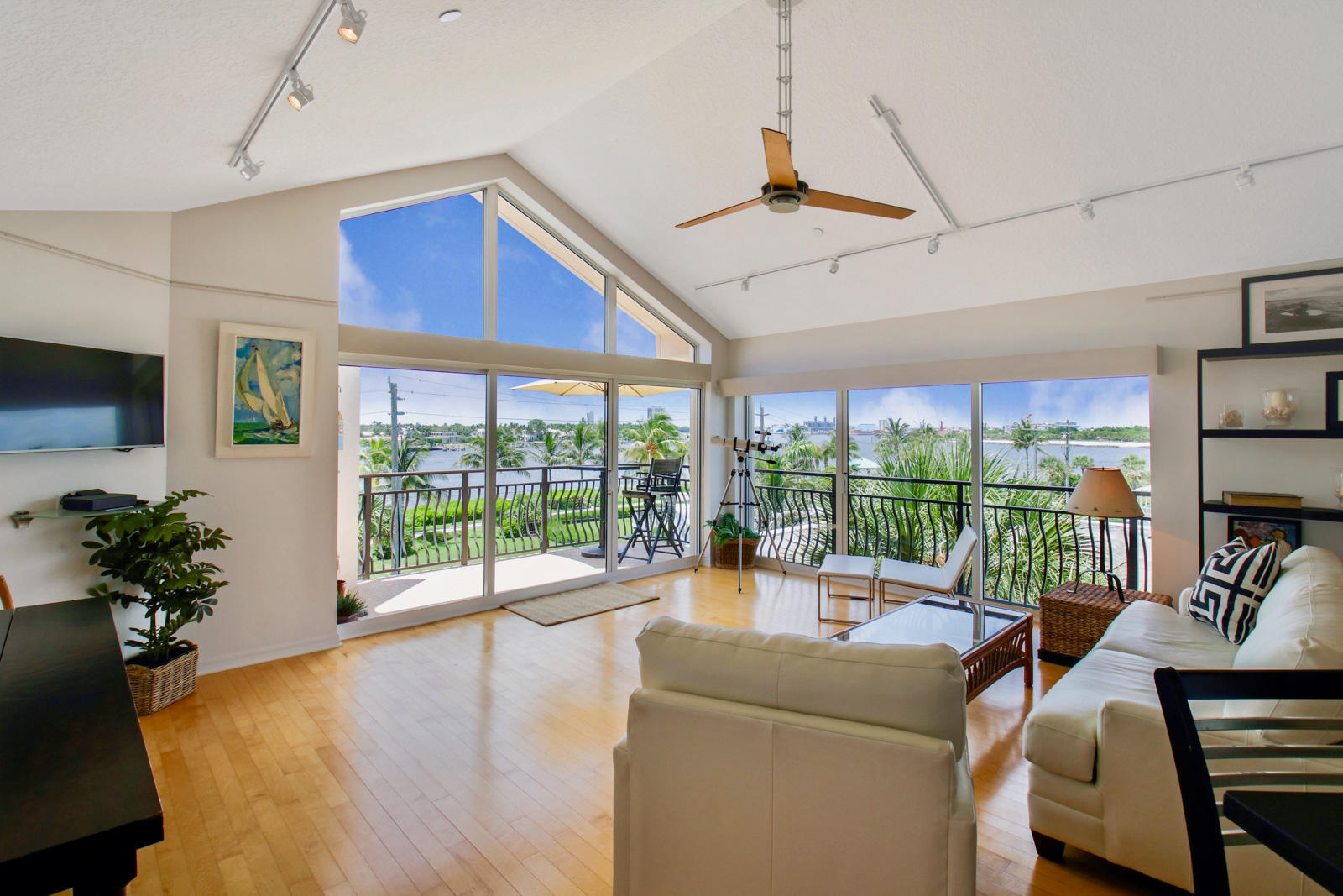 314 Inlet Way, Unit 303 Palm Beach Shores, FL 33404 - Photo 3 of 33 a living room with furniture floor to ceiling window and a floor to ceiling window