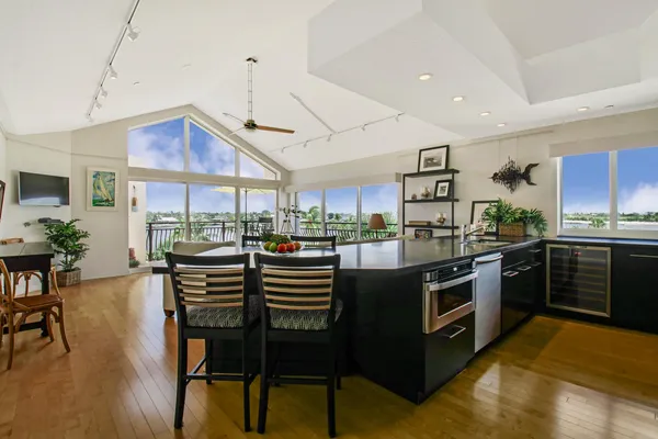 a kitchen with a refrigerator and a window