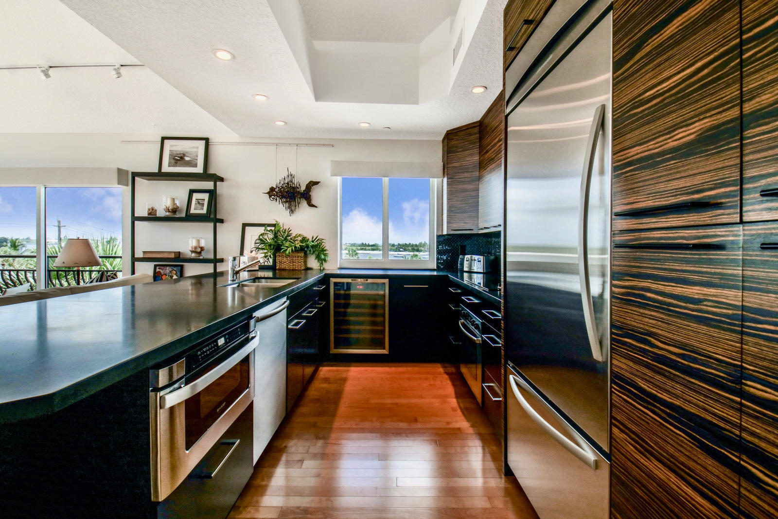 314 Inlet Way, Unit 303 Palm Beach Shores, FL 33404 - Photo 5 of 33 a kitchen with stainless steel appliances granite countertop a stove a sink and a refrigerator