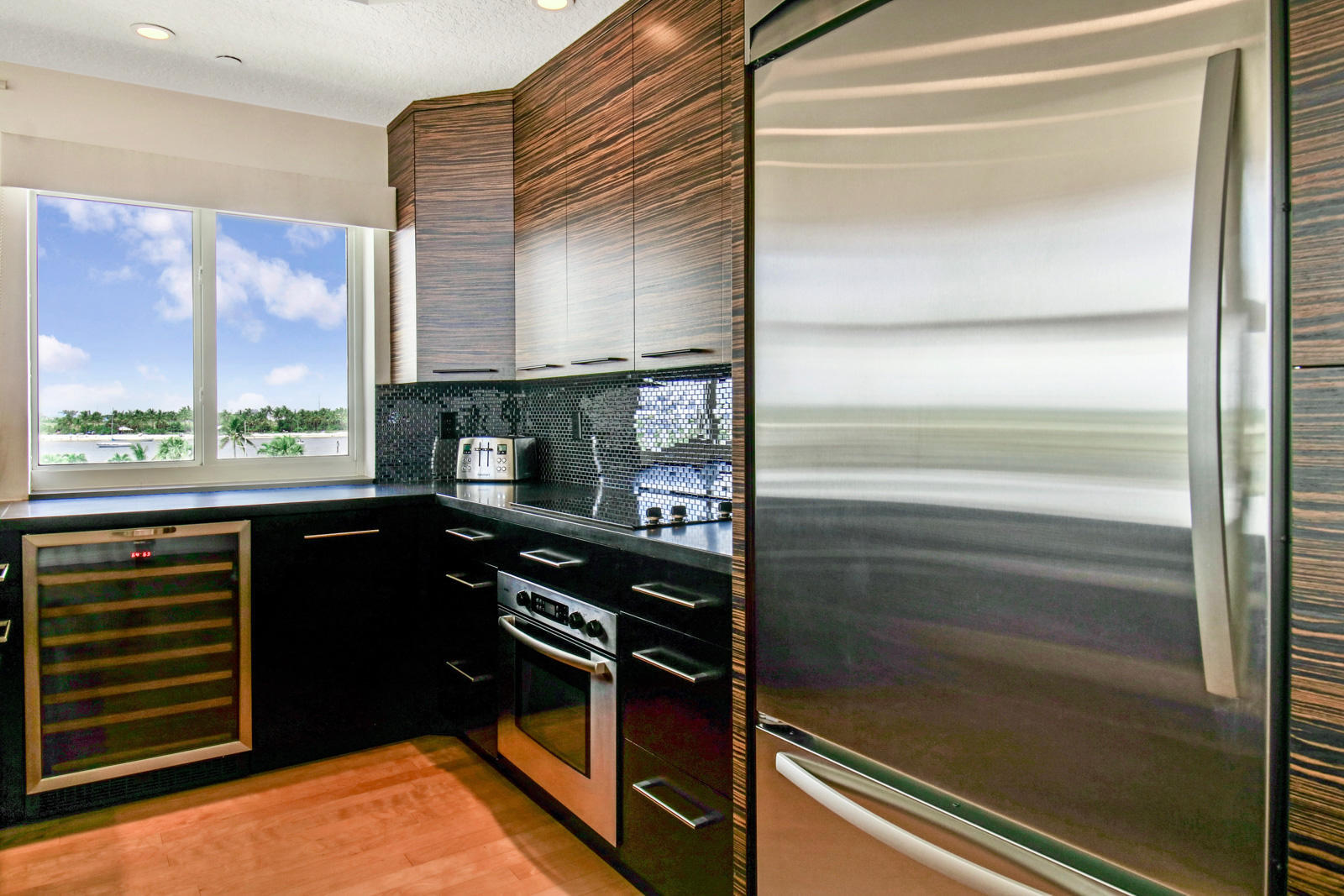 314 Inlet Way, Unit 303 Palm Beach Shores, FL 33404 - Photo 6 of 33 a kitchen with a refrigerator and a window