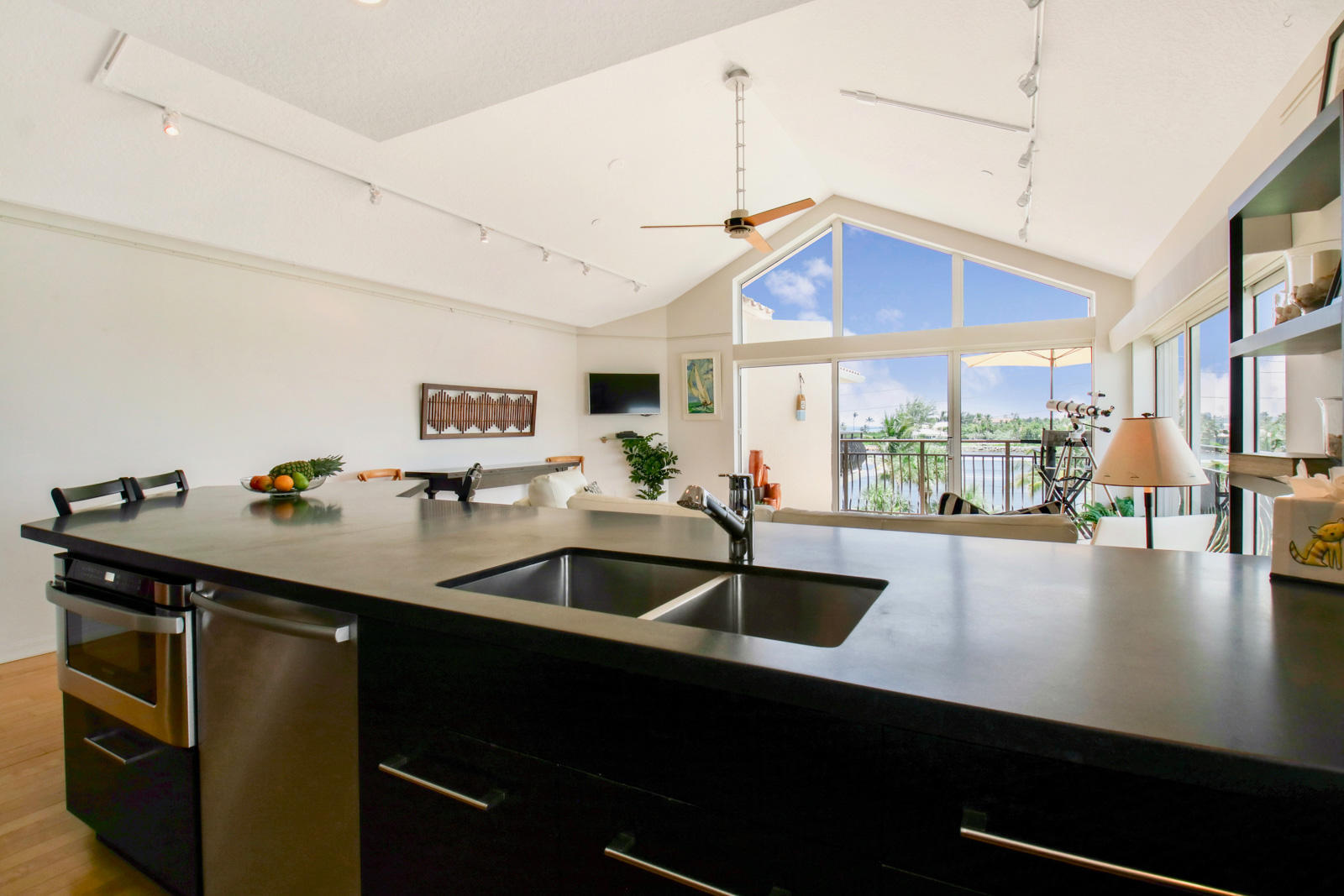 314 Inlet Way, Unit 303 Palm Beach Shores, FL 33404 - Photo 7 of 33 a kitchen with sink cabinets and window