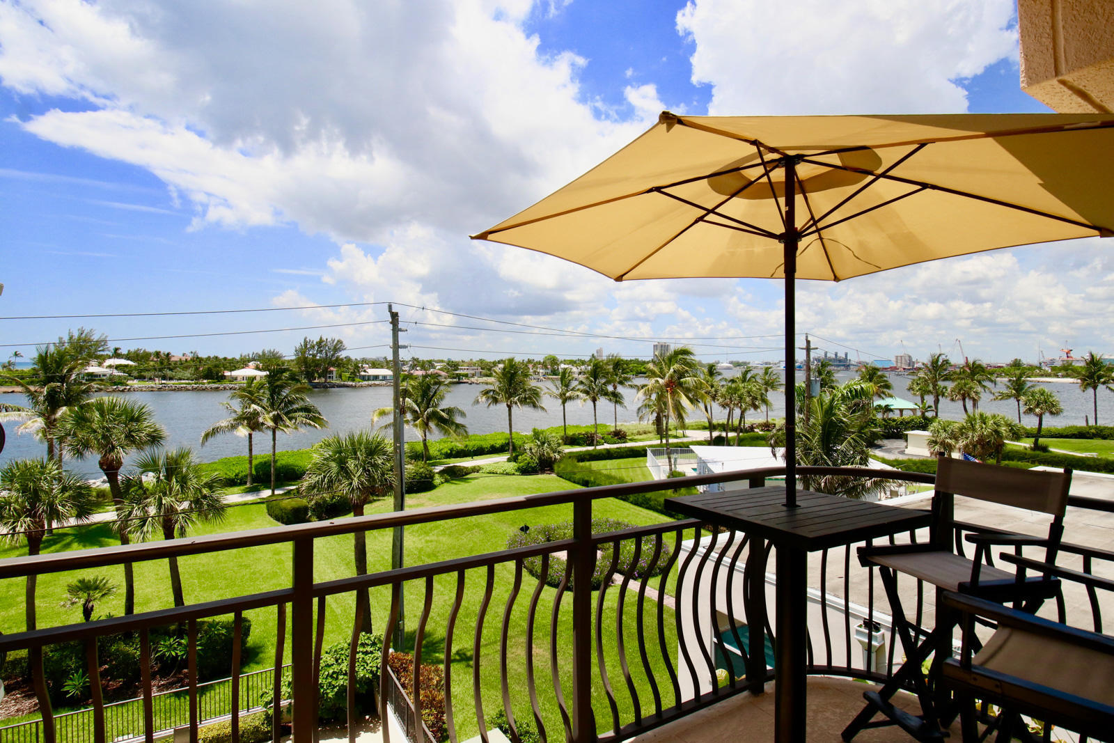 314 Inlet Way, Unit 303 Palm Beach Shores, FL 33404 - Photo 10 of 33 a view of a chairs and table in the balcony