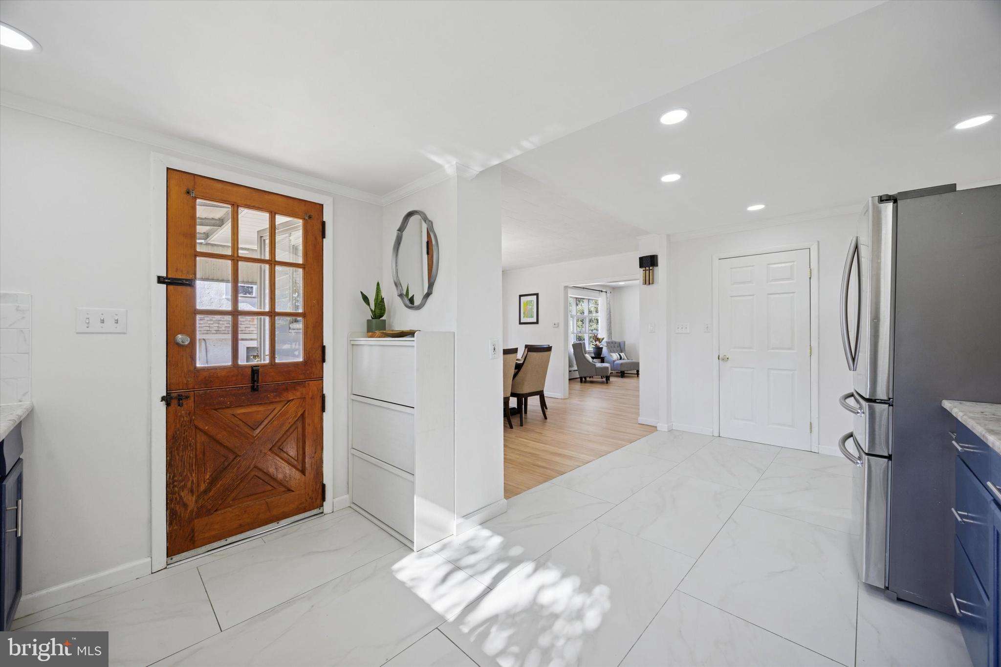 217 Windsor Avenue Upper Darby, PA 19082 - Photo 13 of 36 a hallway with a large window in a kitchen