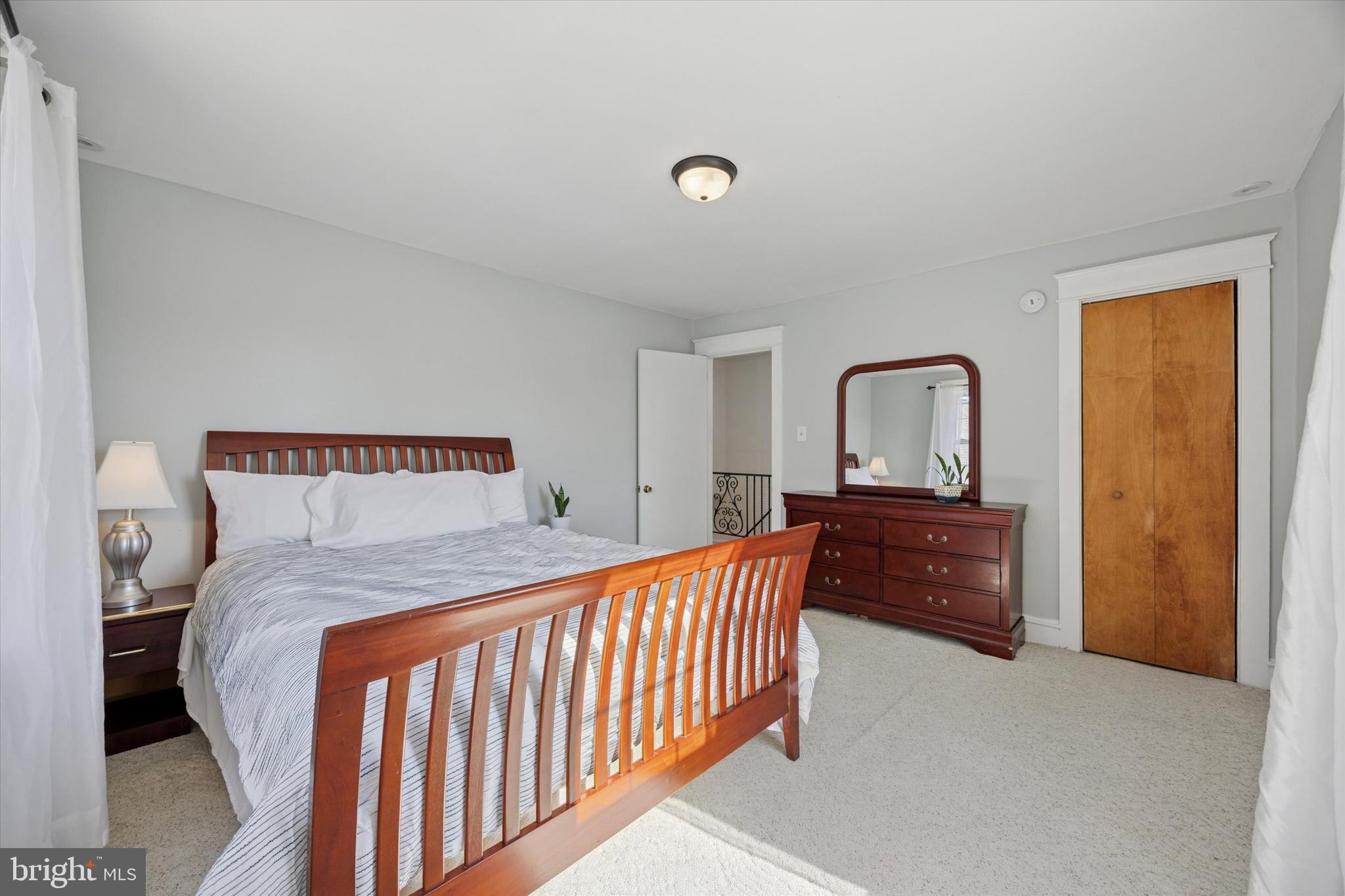 217 Windsor Avenue Upper Darby, PA 19082 - Photo 18 of 36 a bedroom with a bed and a dresser