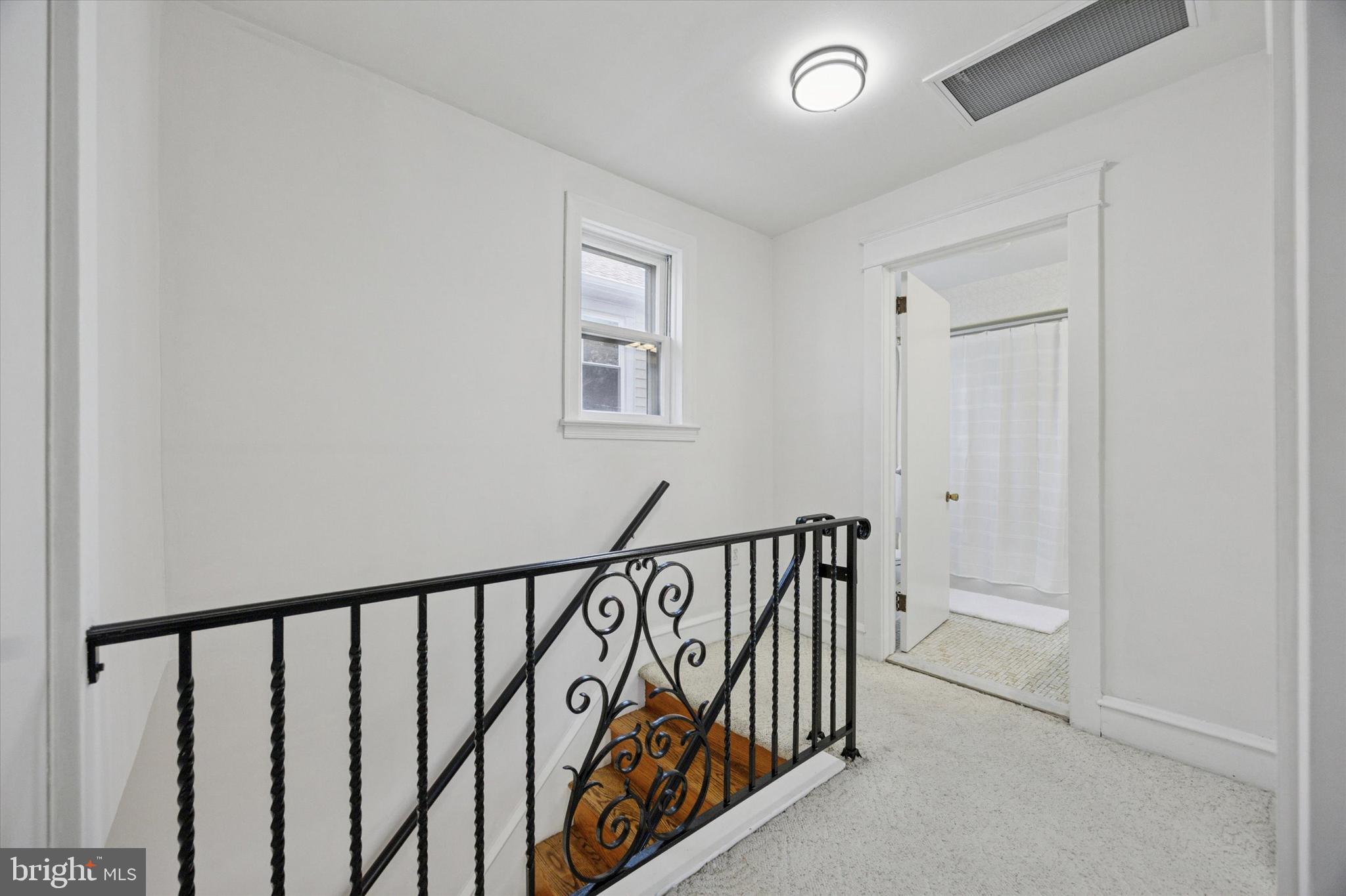 217 Windsor Avenue Upper Darby, PA 19082 - Photo 21 of 36 a view of a hallway with a window