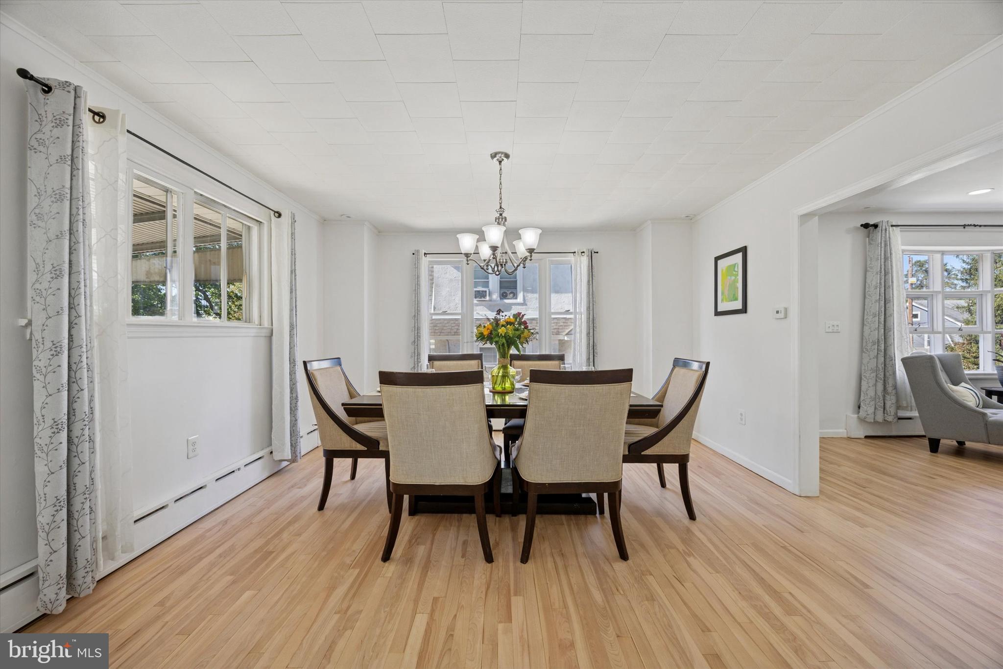 217 Windsor Avenue Upper Darby, PA 19082 - Photo 10 of 36 a view of a dining room with furniture window and wooden floor