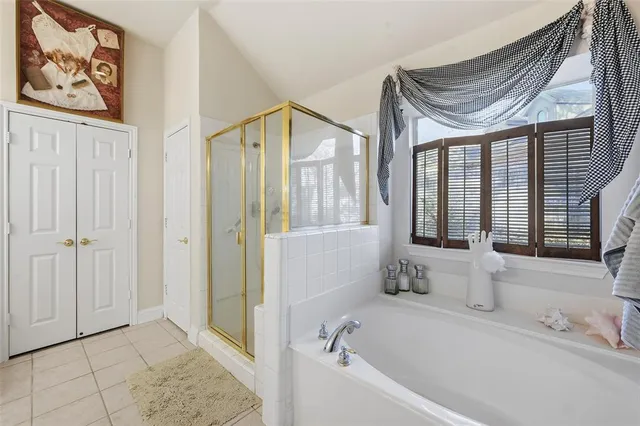a bathroom with a bathtub and a shower