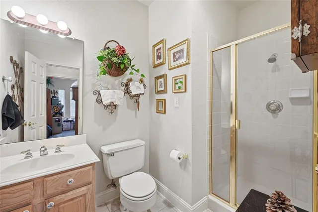 a bathroom with a toilet sink and shower