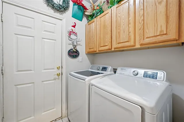 a utility room with dryer and washer