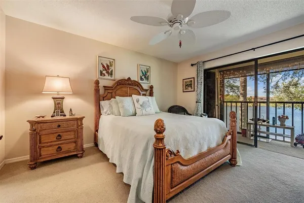 a bed room with a bed and a night stand