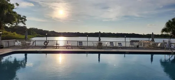 a view of parking garage with cars parked