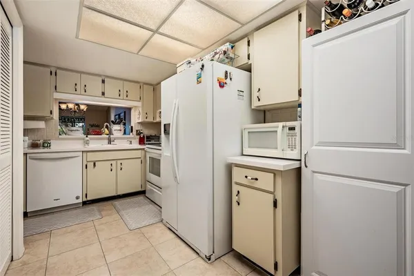 a kitchen with a refrigerator a sink and dishwasher