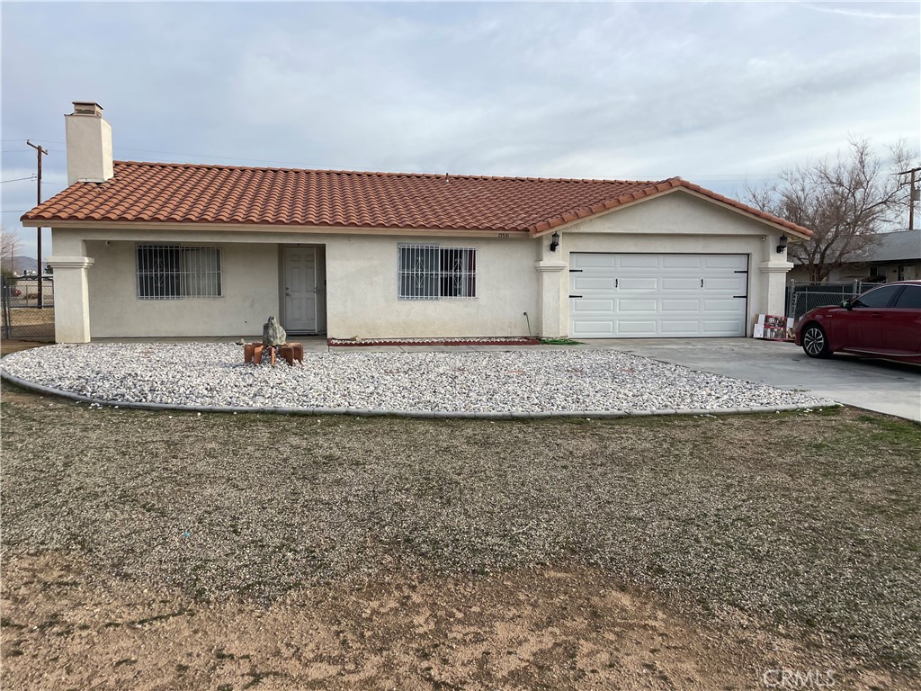 15531 Tonekai Road Apple Valley, CA 92307 - Photo 1 of 1 a view of a house with a patio and a yard