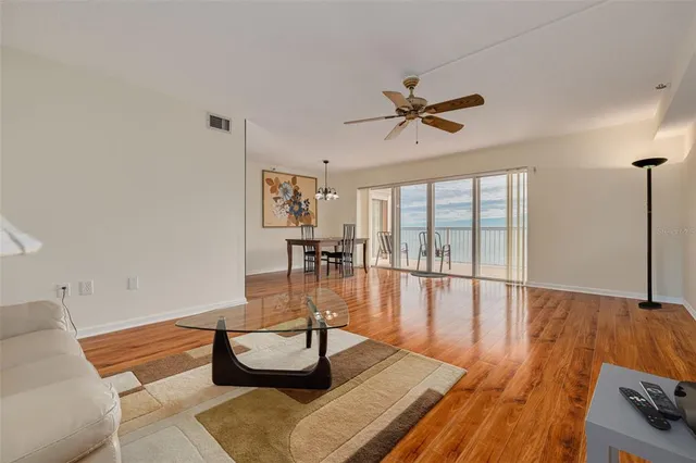 a view of a balcony with chair and floor to ceiling window