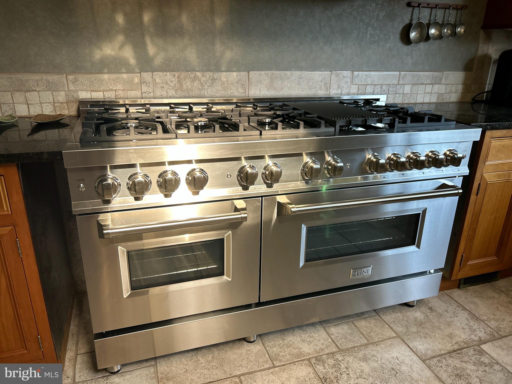 329 Tunbridge Road Baltimore, MD 21212 - Photo 21 of 76 a stove top oven sitting inside of a kitchen
