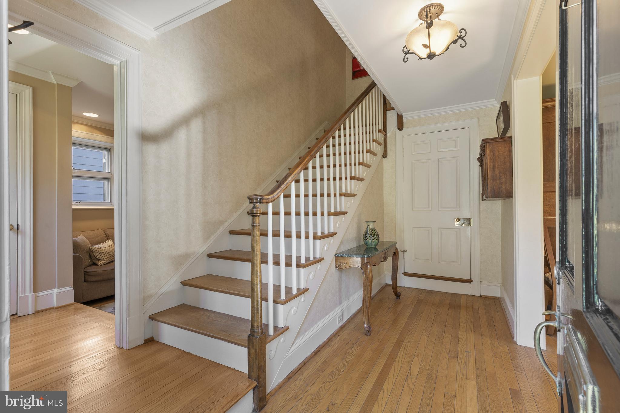 329 Tunbridge Road Baltimore, MD 21212 - Photo 29 of 76 a view of a hallway with wooden floor and staircase