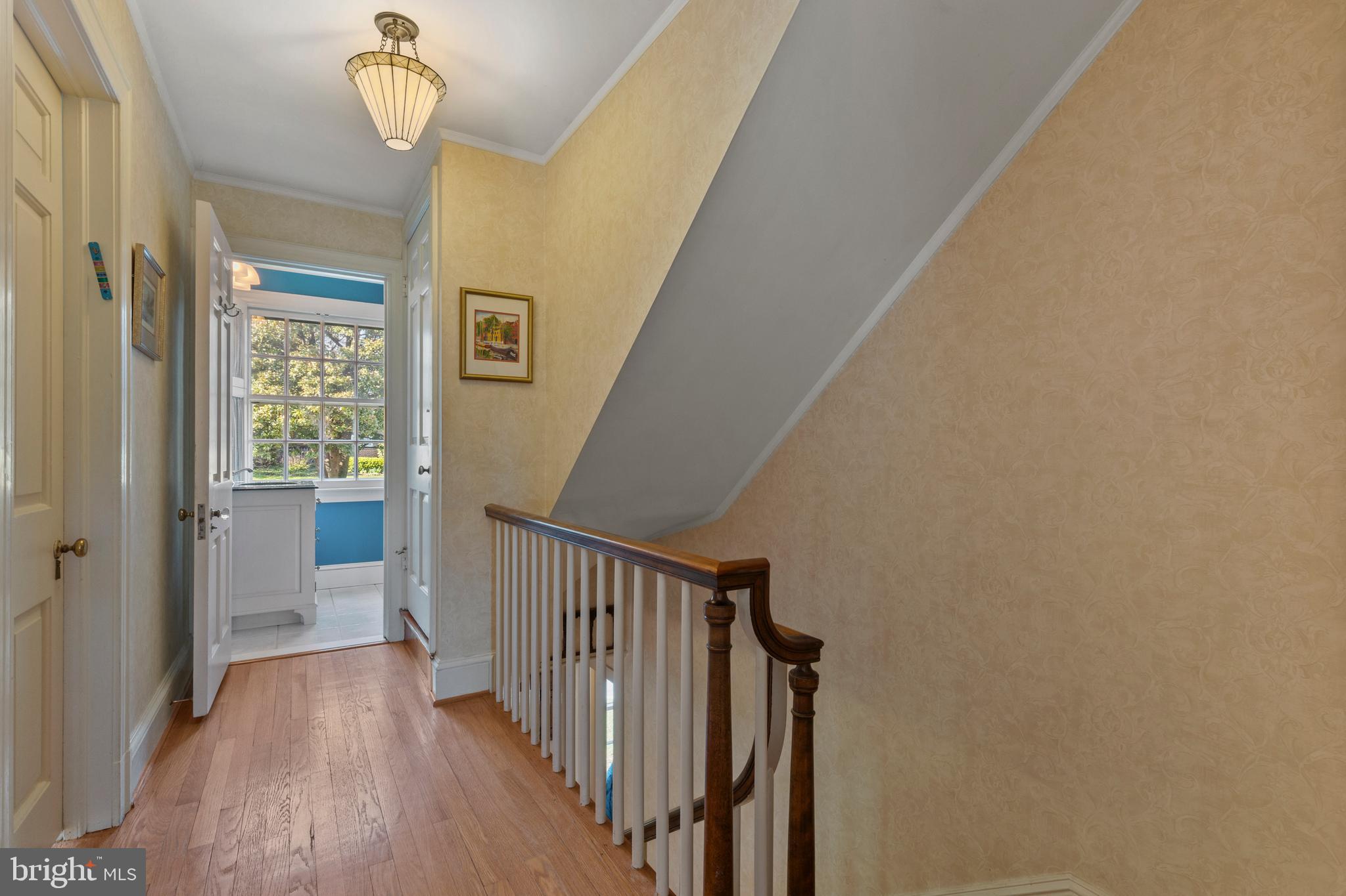 329 Tunbridge Road Baltimore, MD 21212 - Photo 30 of 76 a view of a hallway with wooden floor and staircase