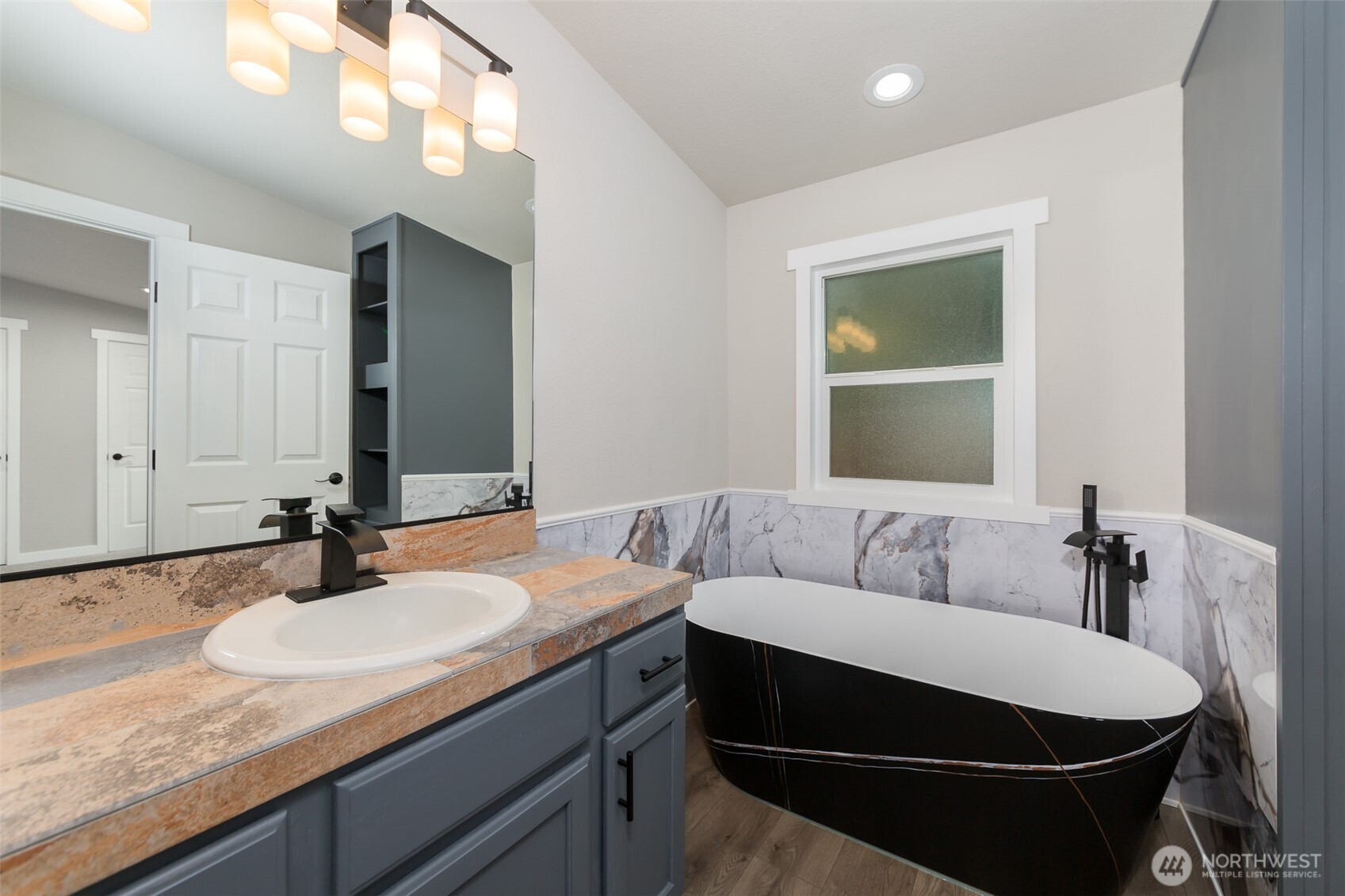 225 North Lake Roesiger Road Snohomish, WA 98290 - Photo 14 of 40 a bathroom with a granite countertop sink and a mirror