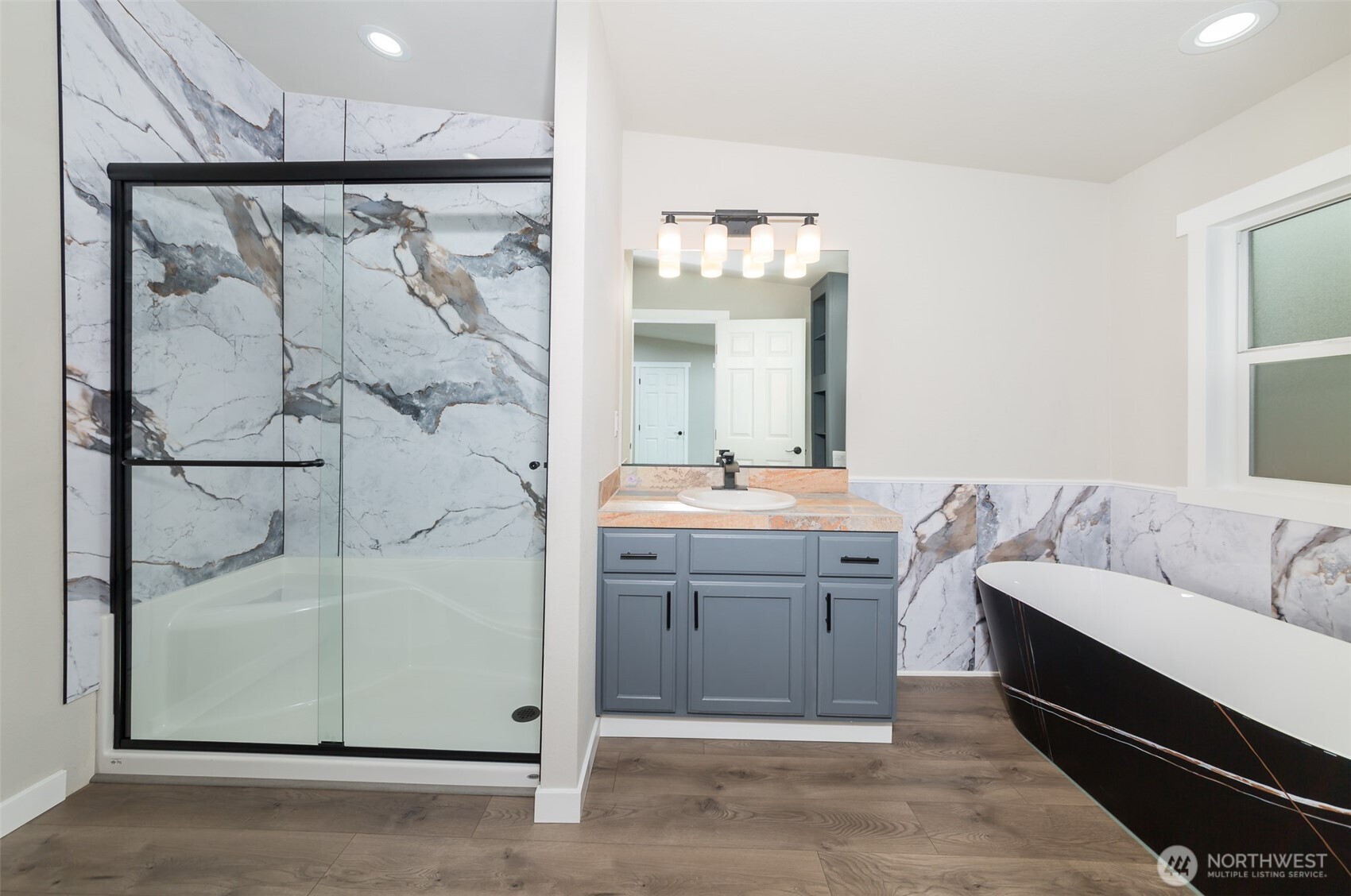 225 North Lake Roesiger Road Snohomish, WA 98290 - Photo 15 of 40 a bathroom with a double vanity sink mirror and shower
