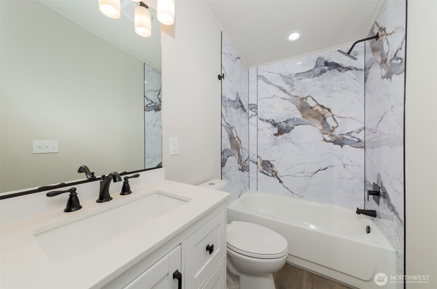 225 North Lake Roesiger Road Snohomish, WA 98290 - Photo 20 of 40 a bathroom with a sink toilet vanity and shower