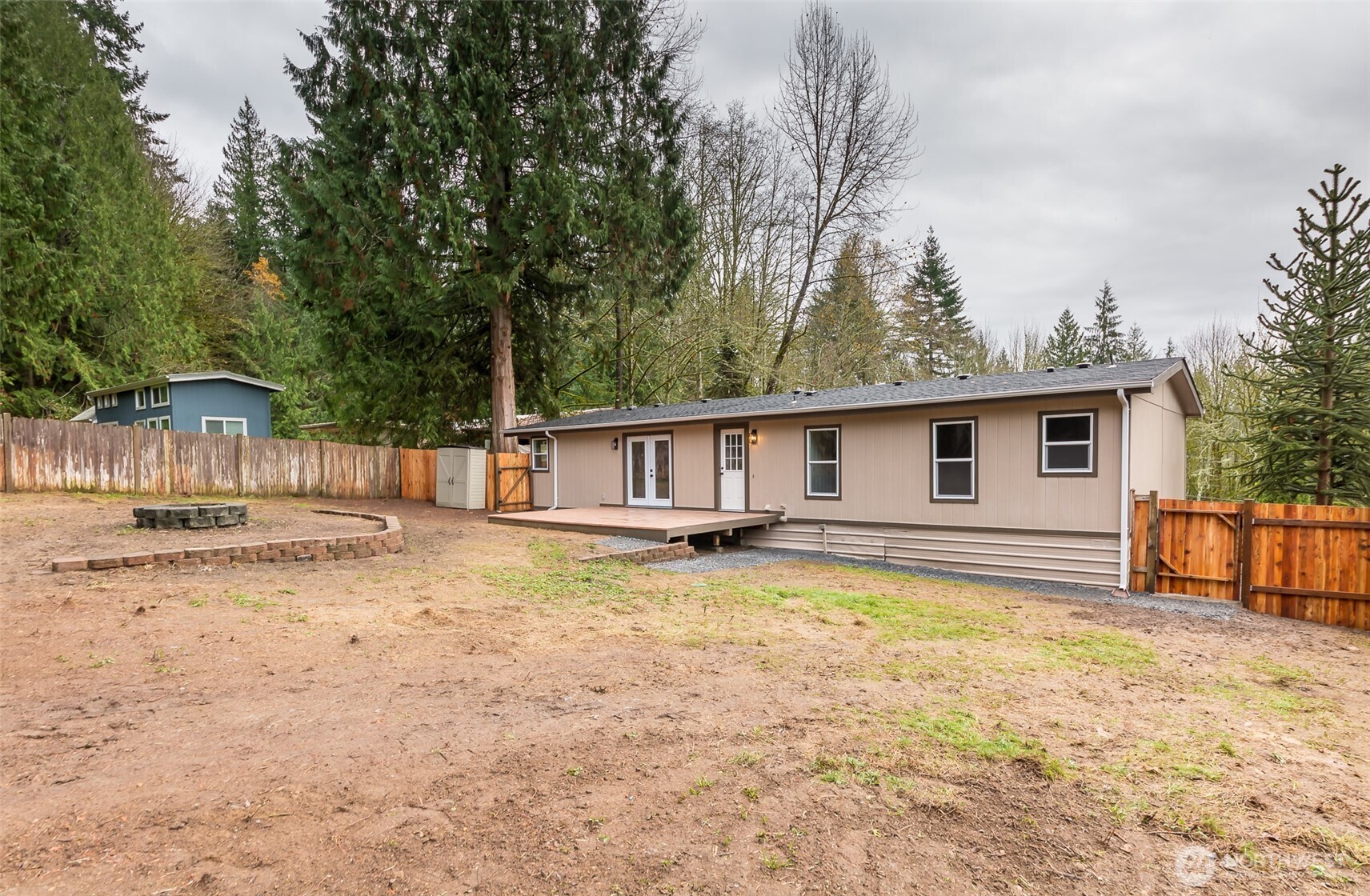 225 North Lake Roesiger Road Snohomish, WA 98290 - Photo 22 of 40 a view of a house with swimming pool and sitting area