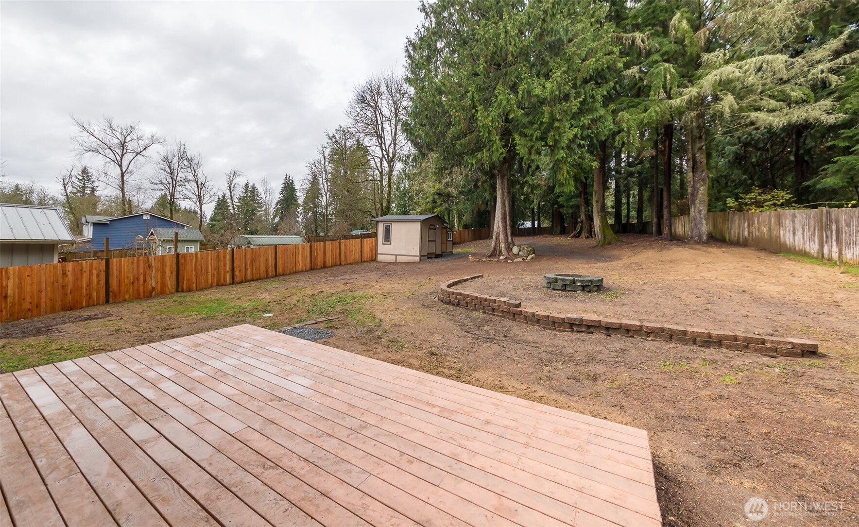 225 North Lake Roesiger Road Snohomish, WA 98290 - Photo 25 of 40 a view of a backyard with wooden fence