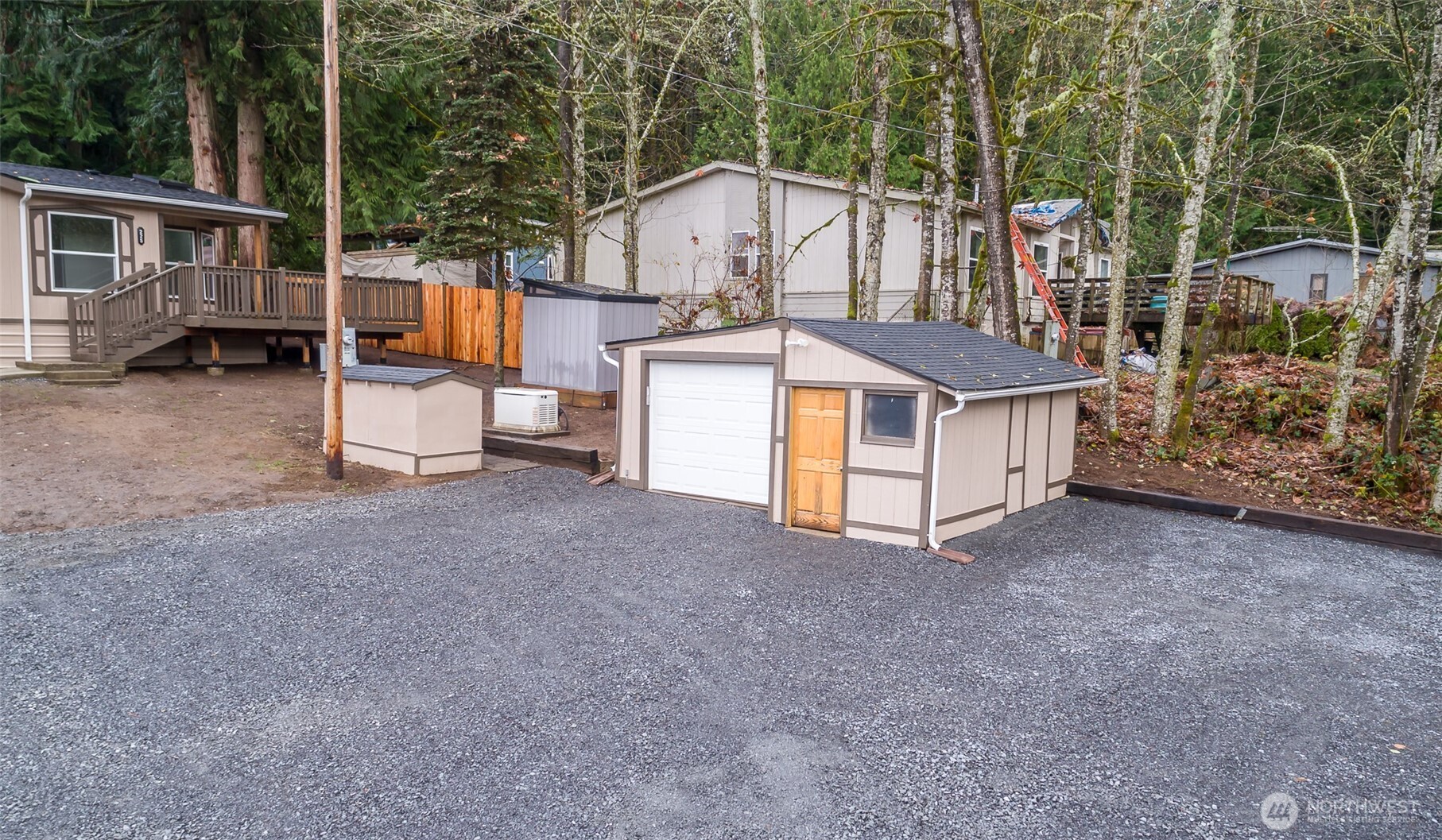 225 North Lake Roesiger Road Snohomish, WA 98290 - Photo 27 of 40 a view of a house with backyard and sitting area