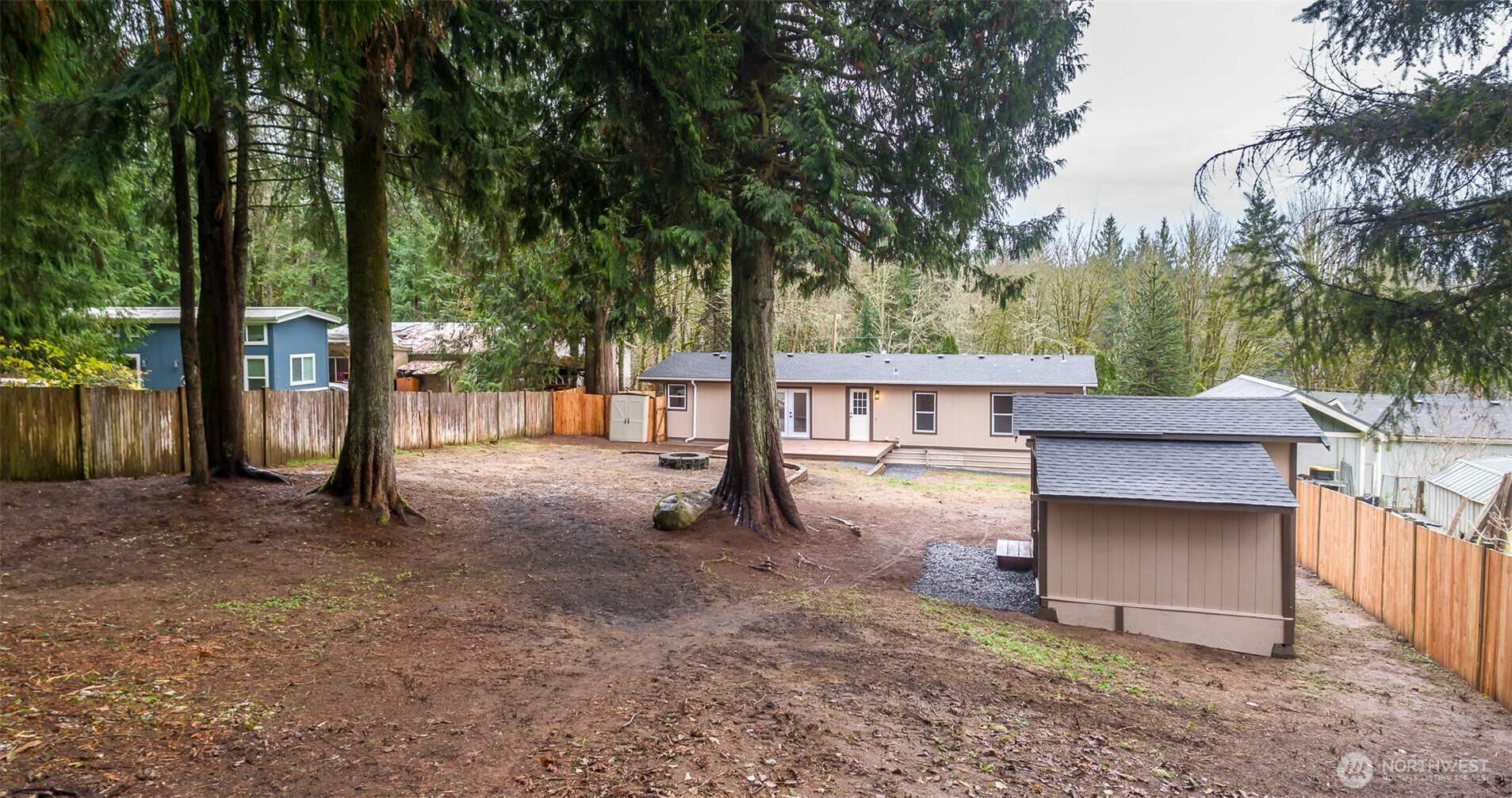 225 North Lake Roesiger Road Snohomish, WA 98290 - Photo 33 of 40 a view of a house with backyard and a tree